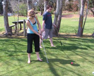 Estelle Baker playing mini golf