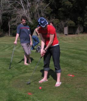 Jane Soper playing mini-golf