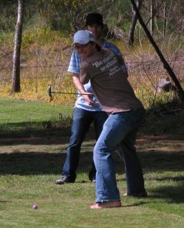 Neil Dudley slap shotting a golf ball